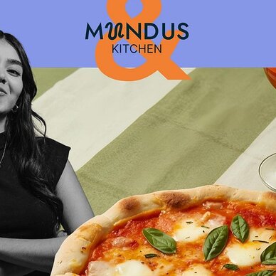 Woman beside pizza and wine glass; 'MUNDUS KITCHEN' text.