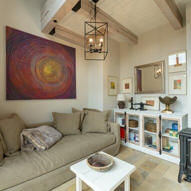 Cozy living room with beige sofa and wall art
