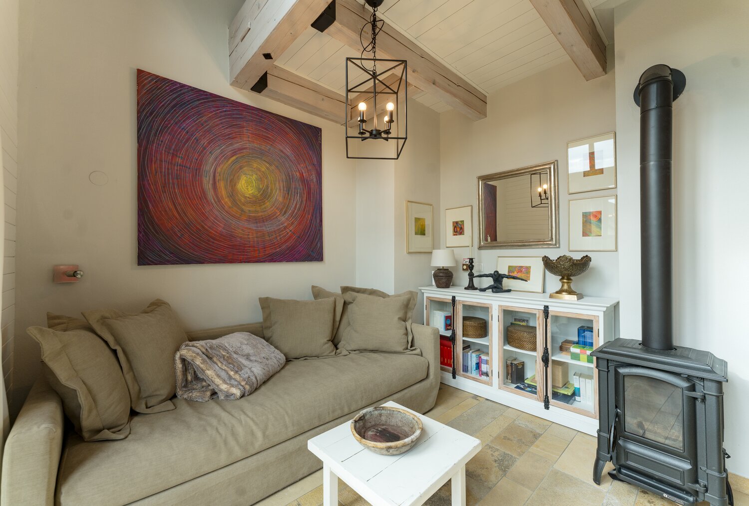 Cozy living room with beige sofa and wall art