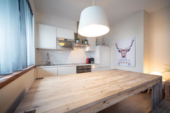 Dining table and kitchen view Dining table and kitchen view