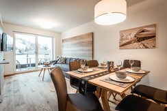 Living room with dining table and sofa Living room with dining table and sofa