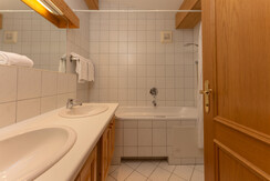 En-suite bathroom with double vanity and toilet En-suite bathroom with double vanity and toilet