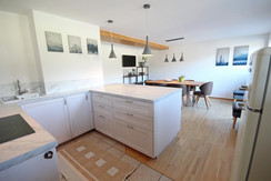Kitchen and view to the dining table Kitchen and view to the dining table