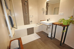 Bathroom with bath tub and separate toilet on the first floor Bathroom with bath tub and separate toilet on the first floor