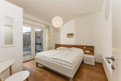 bedroom with doublebed and terrace access bedroom with doublebed and terrace access