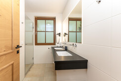 Bathroom with shower & double washbasin Bathroom with shower & double washbasin