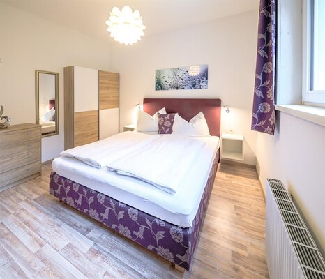 Bedroom 1 with double bed and TV