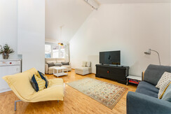Centro Penthouse - Wohnraum mit Flatscreen Centro Penthouse - Wohnraum mit Flatscreen