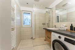 Bathroom with shower and washing machine Bathroom with shower and washing machine