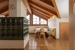 Top 4 living area with tiled stove Top 4 living area with tiled stove