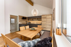 Dining area with view to the kitchen Dining area with view to the kitchen